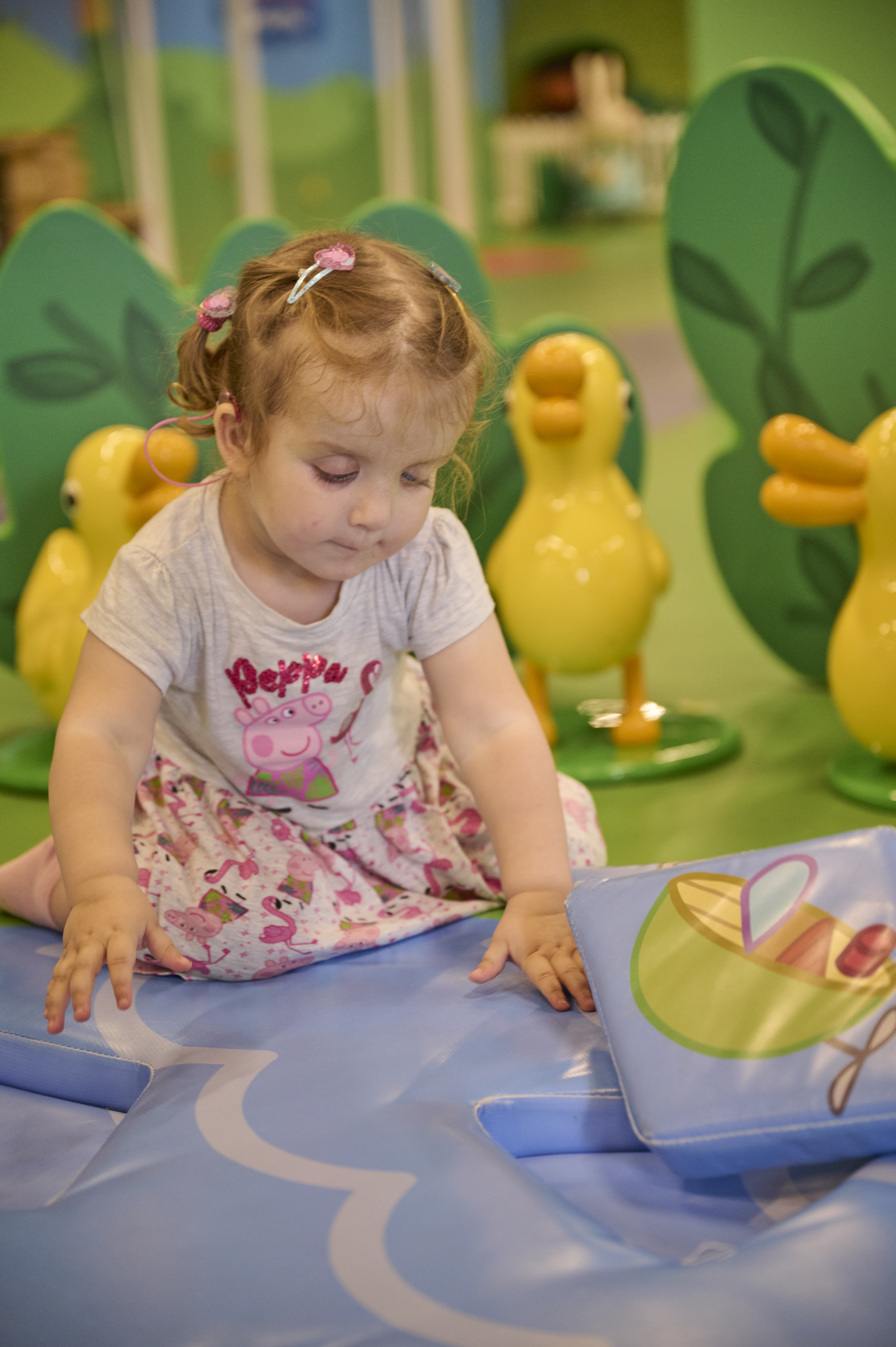 Little girl playing at Peppa Pig World of Play