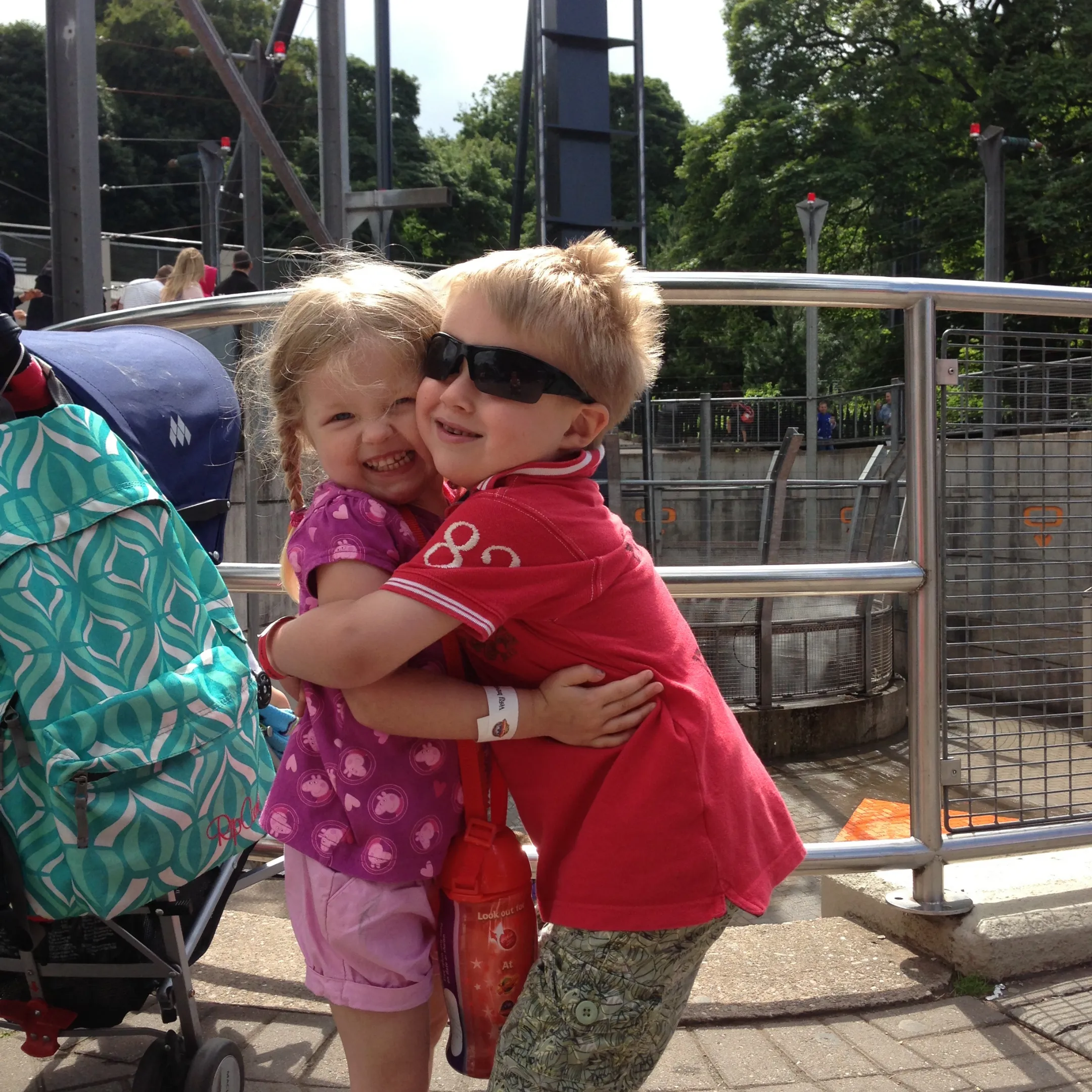 Young boy and girl hugging. 