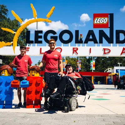 A group of teenagers stand outside LEGOLAND Florida