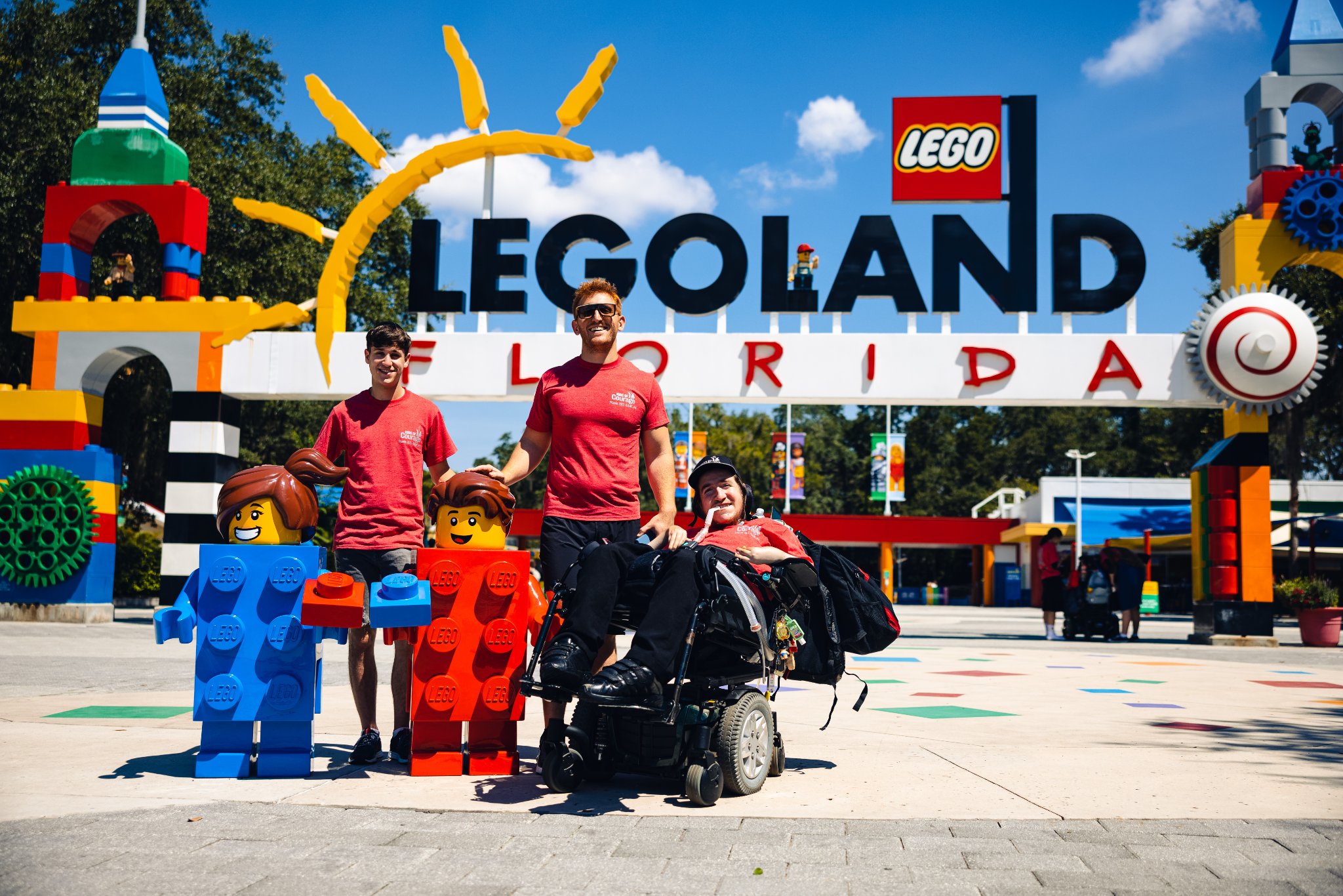 A group of teenagers stand outside LEGOLAND Florida